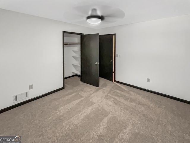 unfurnished bedroom featuring a closet and ceiling fan