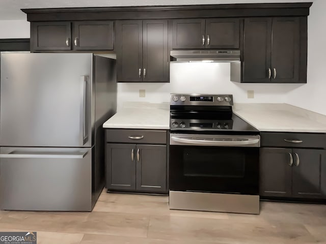 kitchen featuring appliances with stainless steel finishes and light wood-type flooring