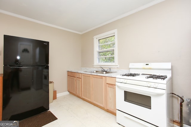 kitchen featuring sink, crown molding, white range with gas cooktop, and black fridge