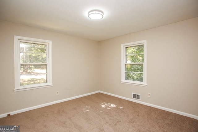 empty room featuring carpet floors