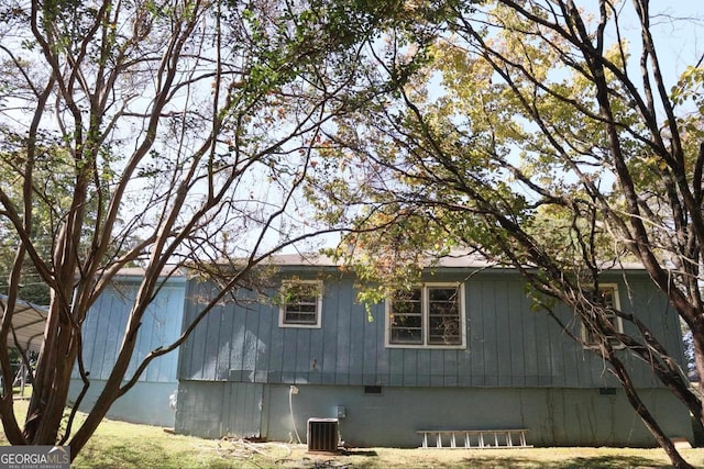 view of side of home with cooling unit