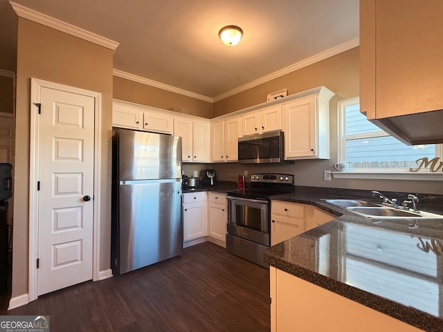 kitchen with stainless steel appliances, sink, dark hardwood / wood-style flooring, crown molding, and white cabinetry