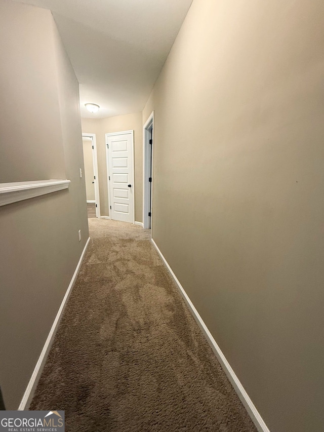 corridor featuring carpet floors