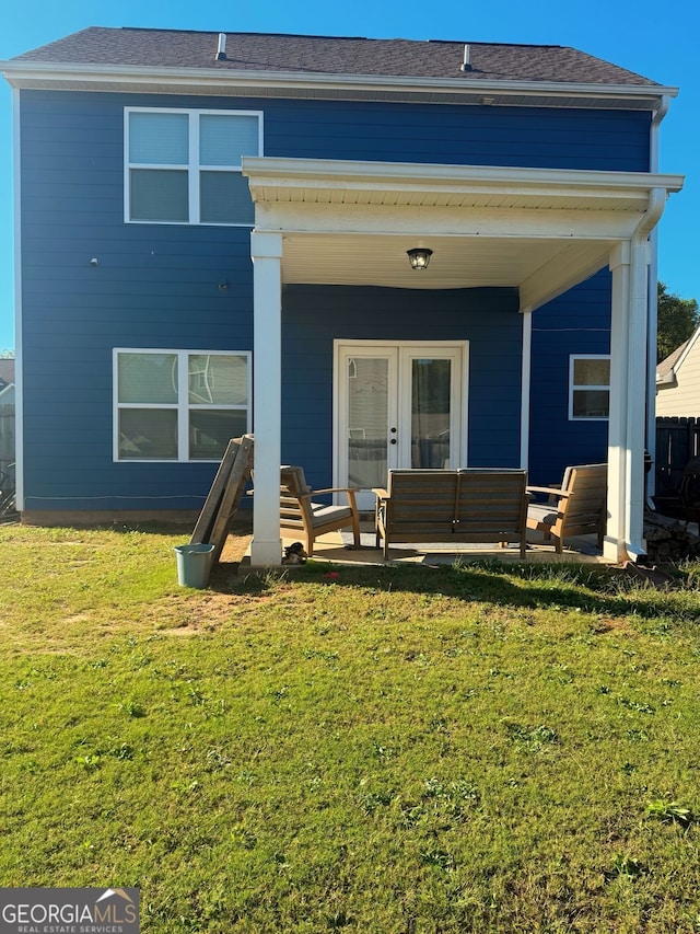 rear view of house featuring an outdoor hangout area, a yard, and a patio area