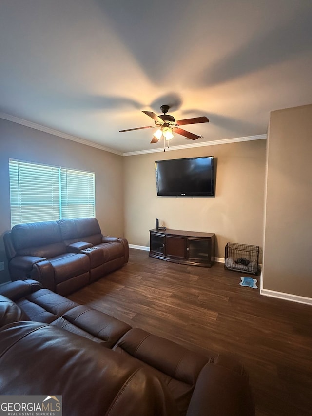 living room featuring ornamental molding, ceiling fan, and dark hardwood / wood-style floors