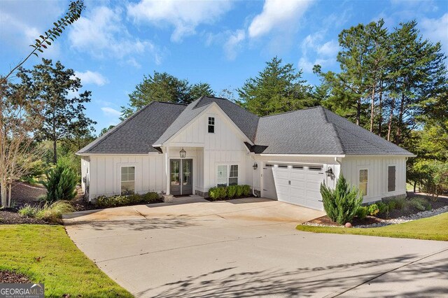 modern farmhouse style home featuring a garage