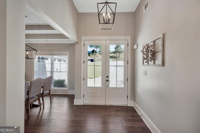 doorway featuring a healthy amount of sunlight, french doors, and dark hardwood / wood-style floors