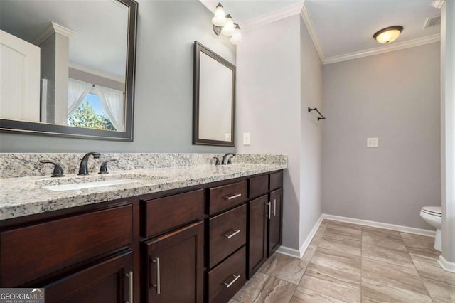 bathroom featuring crown molding, toilet, and vanity