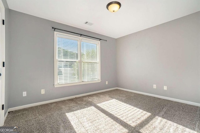 spare room featuring carpet flooring