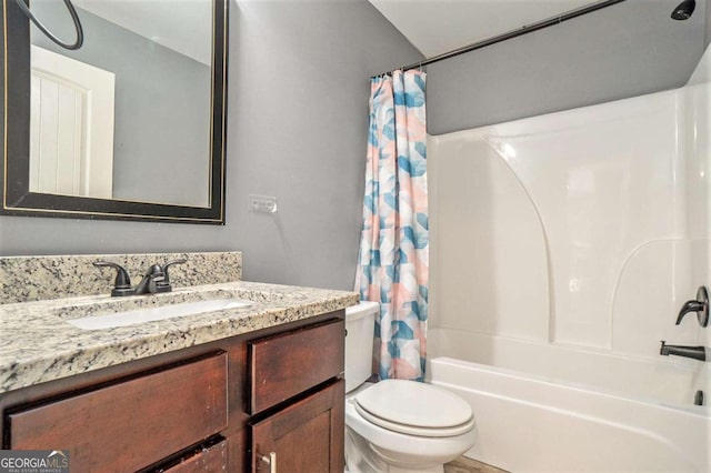 full bathroom featuring shower / tub combo, vanity, and toilet