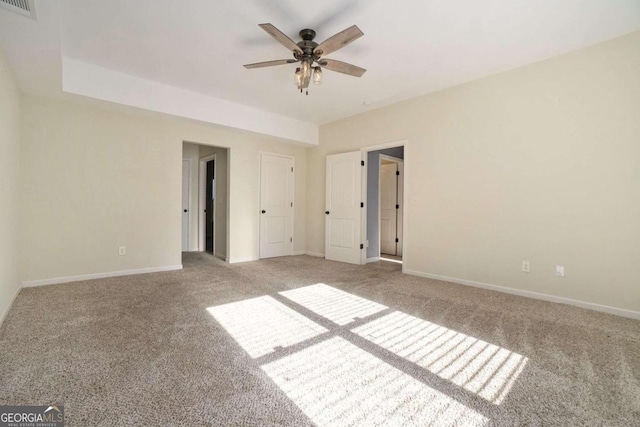 unfurnished bedroom featuring light carpet and ceiling fan