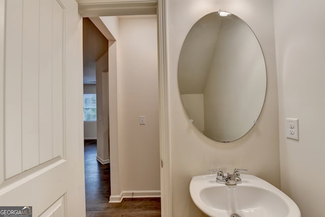 bathroom with hardwood / wood-style floors and sink