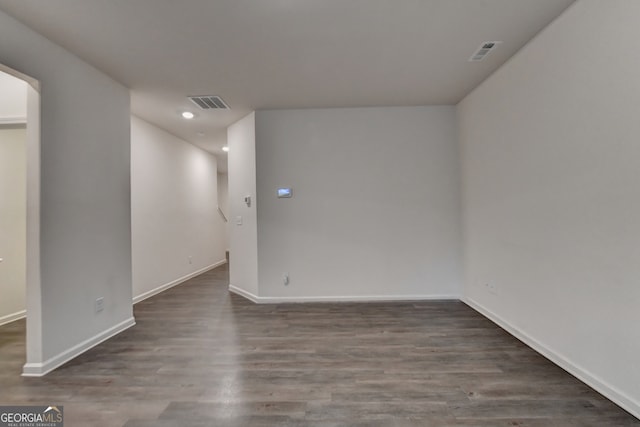 empty room with dark hardwood / wood-style floors