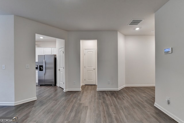 spare room with wood-type flooring