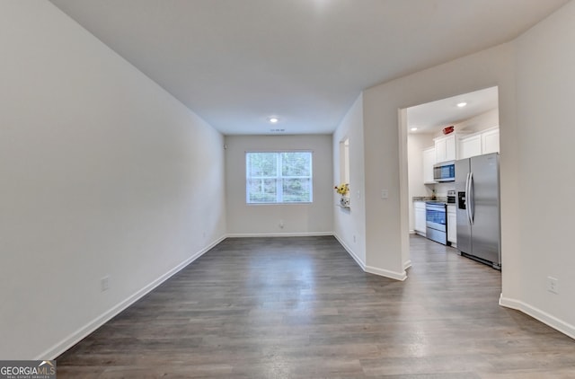 spare room with hardwood / wood-style flooring