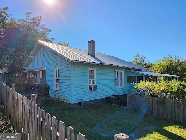 view of home's exterior featuring a yard