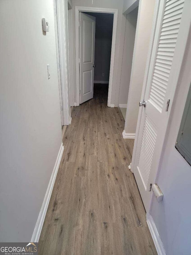 corridor featuring light hardwood / wood-style flooring