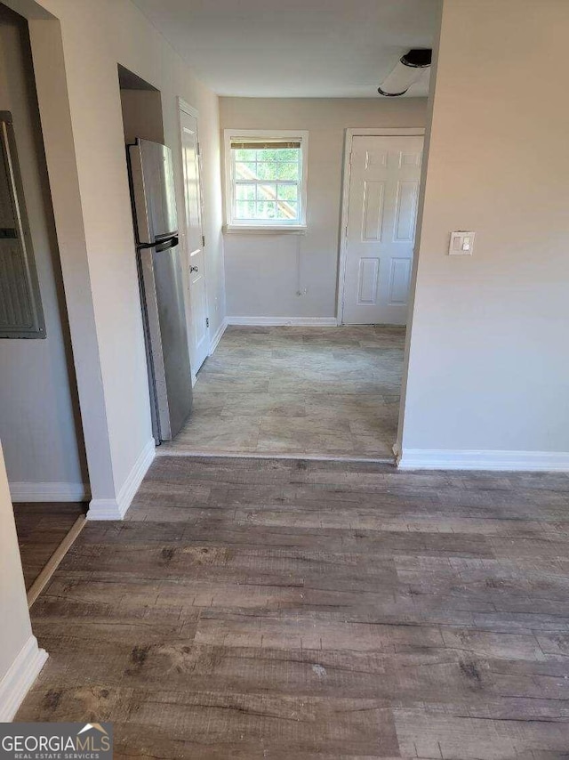 hall with light hardwood / wood-style floors