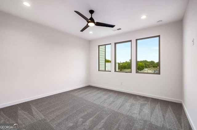 carpeted empty room featuring ceiling fan