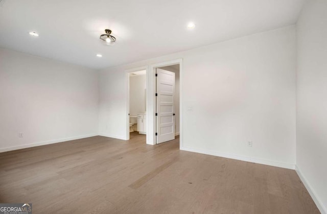 spare room featuring hardwood / wood-style floors