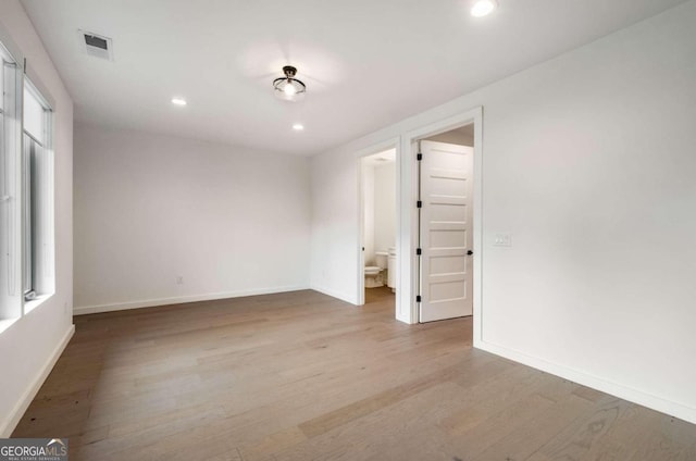 spare room featuring light wood-type flooring