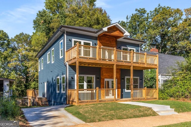 contemporary home with a front yard and a porch