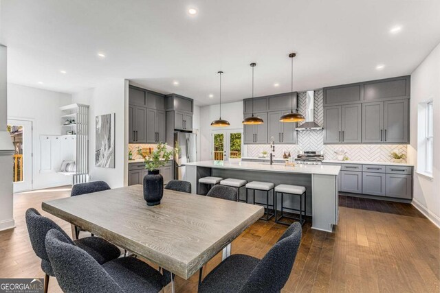 dining area with sink and dark hardwood / wood-style floors