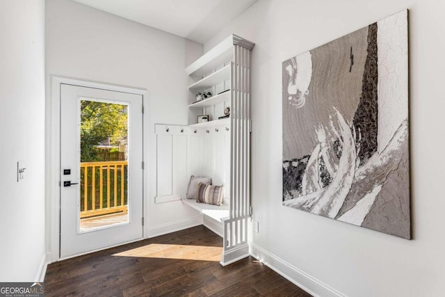 mudroom with baseboards and wood finished floors