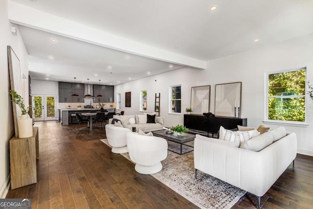 living area with recessed lighting, dark wood-style floors, and beamed ceiling