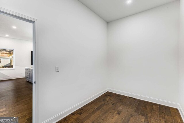 empty room featuring dark hardwood / wood-style floors