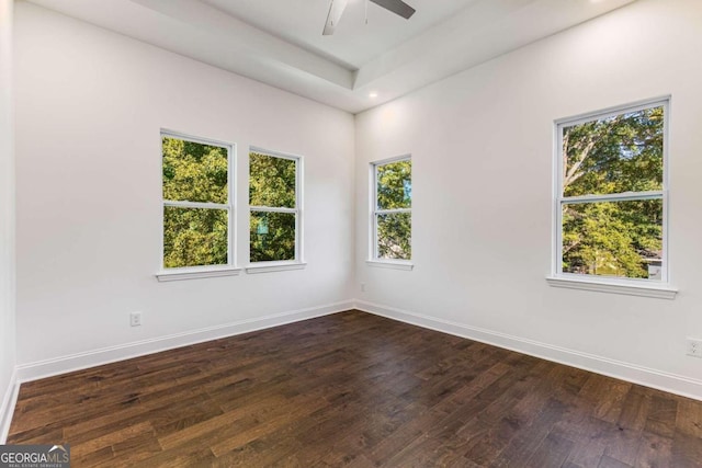 empty room featuring ceiling fan, baseboards, dark wood-style floors, and recessed lighting