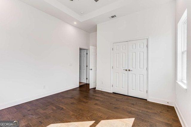 unfurnished bedroom featuring visible vents, baseboards, recessed lighting, and wood finished floors
