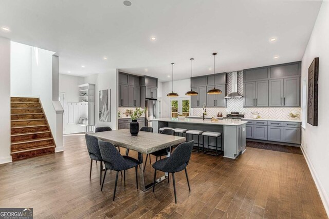 dining room with dark wood-type flooring and sink