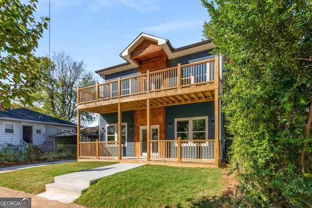 view of front facade featuring a front yard and a porch