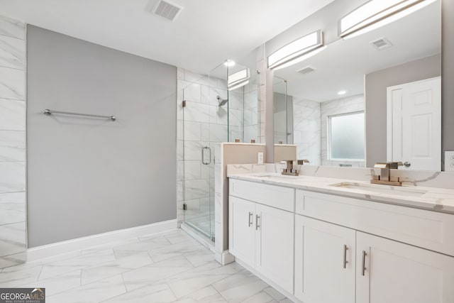 397 S Gordon Rd SW, Mableton, GA 30126 - full bathroom featuring a shower stall, marble finish flooring, double vanity, and baseboards