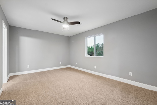 397 S Gordon Rd SW, Mableton, GA 30126 - unfurnished room featuring baseboards, a ceiling fan, and light carpet