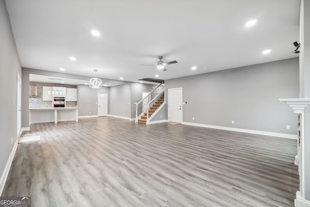 397 S Gordon Rd SW, Mableton, GA 30126 - unfurnished living room featuring ceiling fan, baseboards, recessed lighting, and light wood finished floors