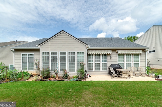 back of house featuring a yard and a patio area