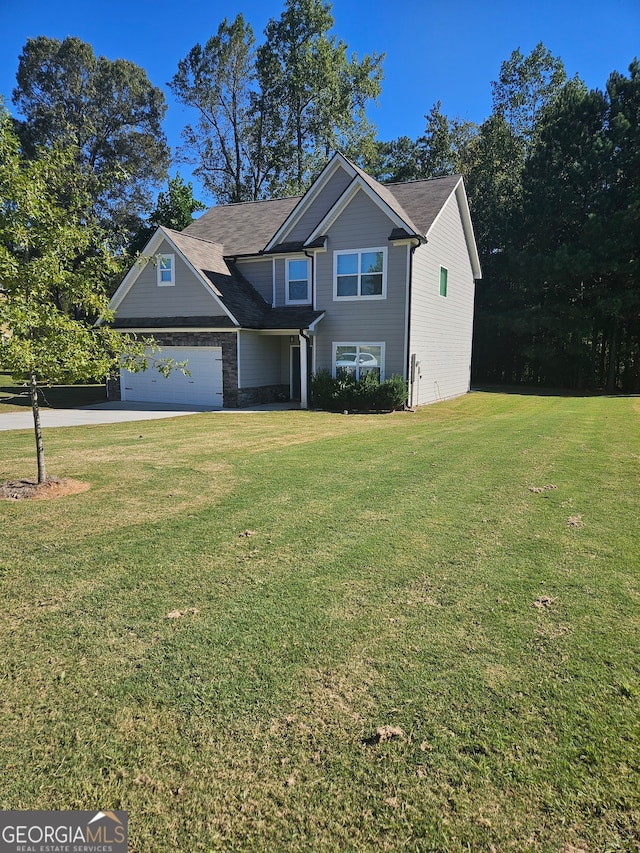 view of front facade featuring a front yard and a garage