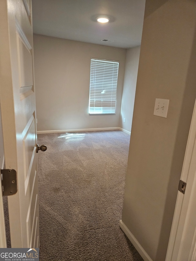 view of carpeted spare room