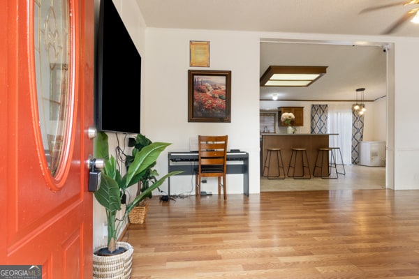 entrance foyer with light hardwood / wood-style floors and ceiling fan