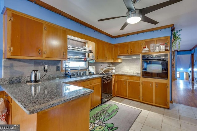 kitchen featuring kitchen peninsula, stone counters, black appliances, and ceiling fan