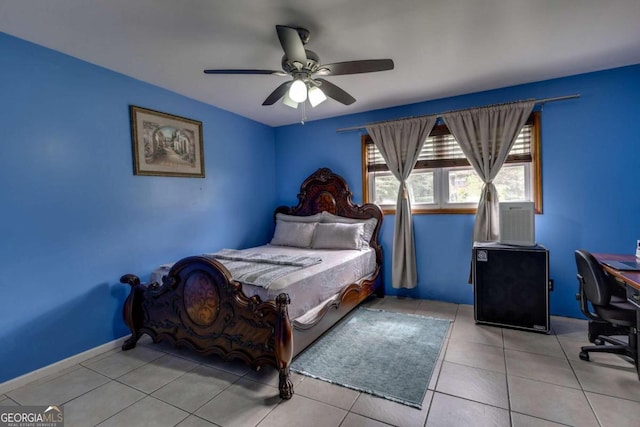 tiled bedroom featuring ceiling fan