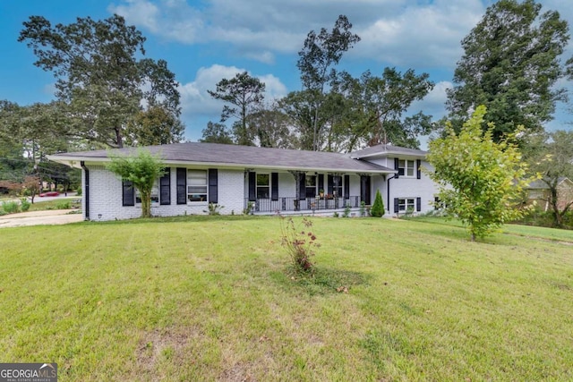 view of front of house featuring a front yard and covered porch