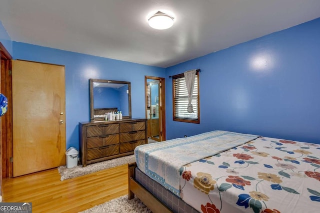 bedroom featuring wood-type flooring