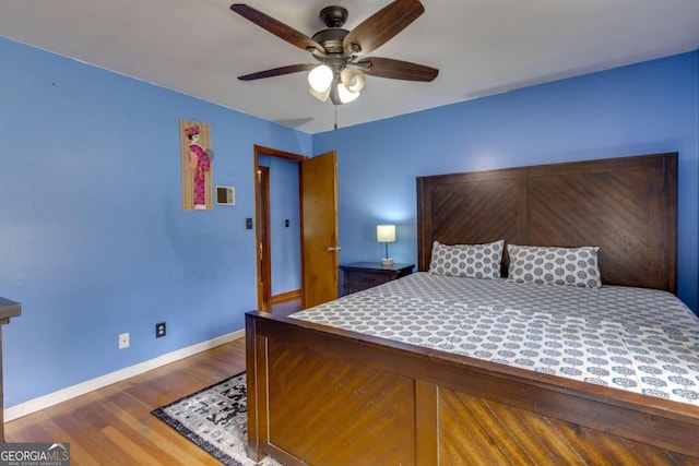 bedroom featuring ceiling fan and wood-type flooring