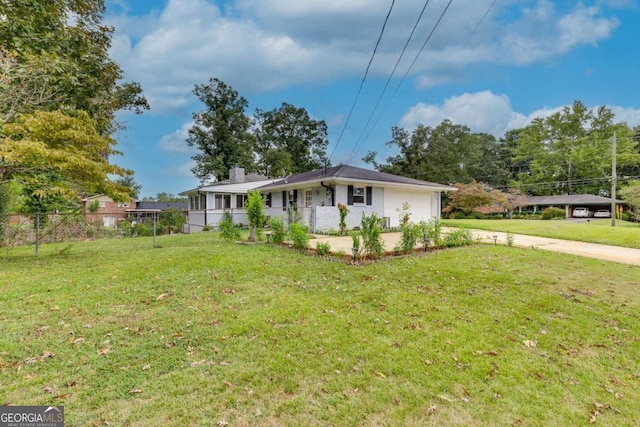 view of side of property with a yard