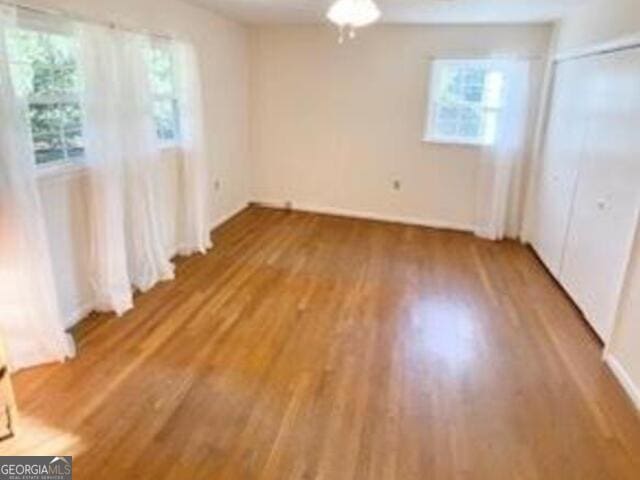 unfurnished bedroom featuring hardwood / wood-style floors