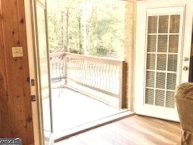 doorway featuring hardwood / wood-style floors