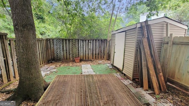 wooden terrace featuring a shed